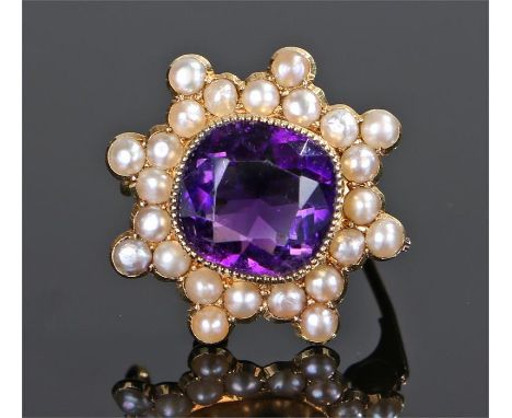 15 carat gold amethyst and pearl set brooch, the central amethyst set to pearl surround, 21mm diameter 