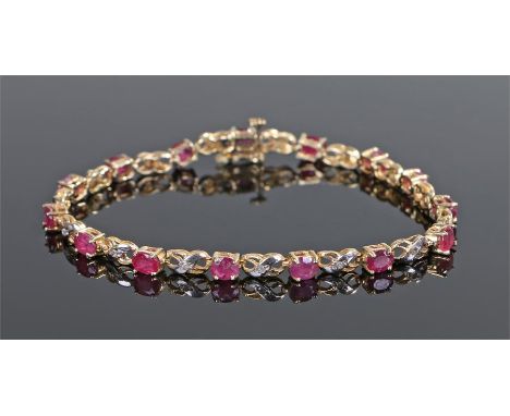 14 carat gold diamond and ruby set bracelet, with ruby and diamond interspersed, 18.5cm long 
