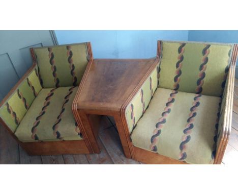 An Art Deco oak three section conversation seat, possibly with its original upholstery, width 170cm, depth 70cm, height 71cm