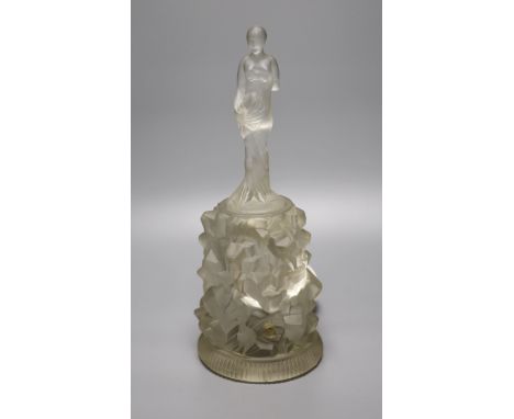 An Art Deco moulded glass figure on an illuminated glass stand