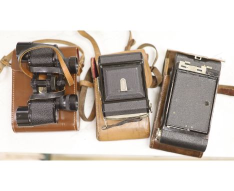 A Kodak Autograph camera, another camera and binoculars