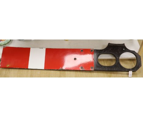 A red and white enamel railway signal