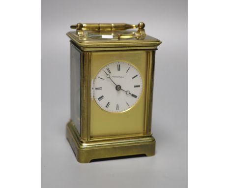 A brass carriage clock by Howell James &amp; Co, height with handle down 13.5cm