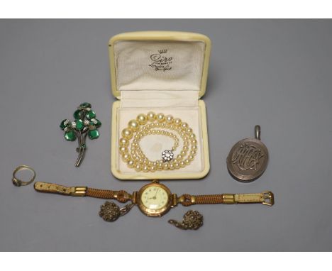 A lady's 585 yellow metal manual wind wrist watch, gross 23.2 grams, a white metal locket and other minor jewellery and a 19t