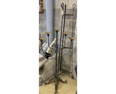 A wrought iron pot stand and large wrought iron five branch floor standing pricket candlestick, candlestick 126cm high
