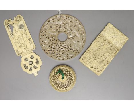 Three pieces of 19th century Chinese export carved ivory to include a card case, a pomander and a decorative panel, together 