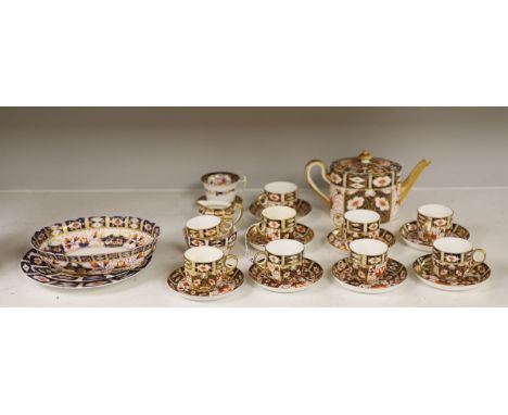 Six Royal Crown Derby coffee cups and saucers and teapot and stand