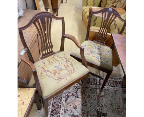 A set of six Hepplewhite style mahogany shield back dining chairs with tapestry drop in seats (two with arms)