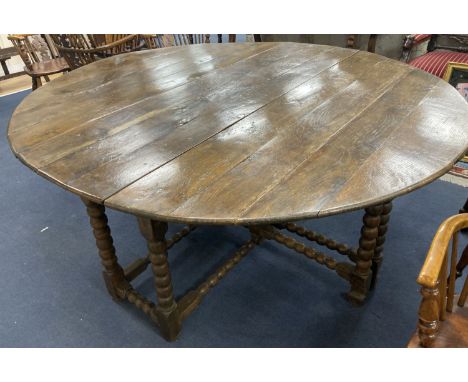 An 18th century and later oak bobbin leg gateleg dining table, length 170cm extended, width 162cm, height 76cm