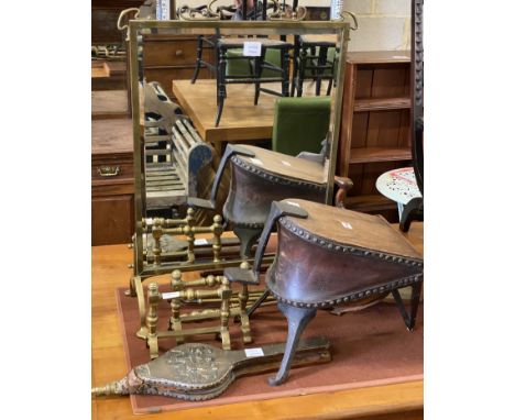 A late Victorian brass framed mirrored firescreen, a pair of brass fire dogs, a pair of bellows, set of bellows ,four brass f