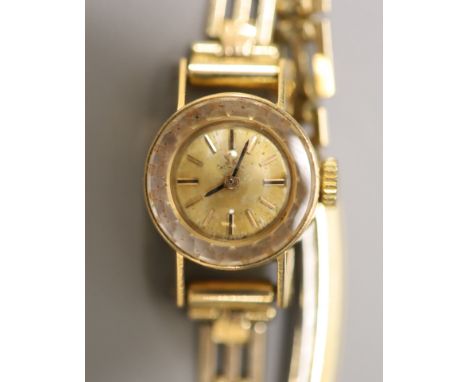 A lady's 1960's 18ct gold Omega manual wind wrist watch, on a gold plated bracelet with box and guarantee, gross weight 15.3 