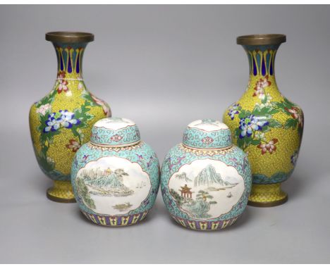 A pair of 20th century Chinese export ginger jars, decorated with vignettes of landscapes over a blue ground, 16 cm high, tog