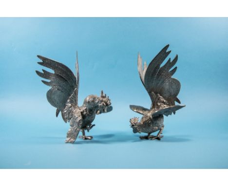 A Vintage Pair of White Metal 'Fighting Cocks' Figures in realistic form. 8.5 inches high.