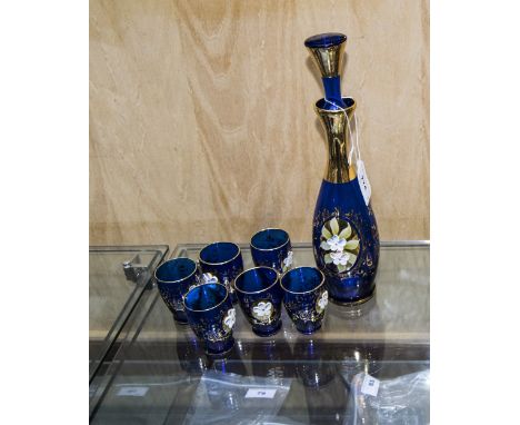 Murano Glass Decanter Set comprising decanter and six tot glasses. With embossed floral decoration and gilt trim. 
