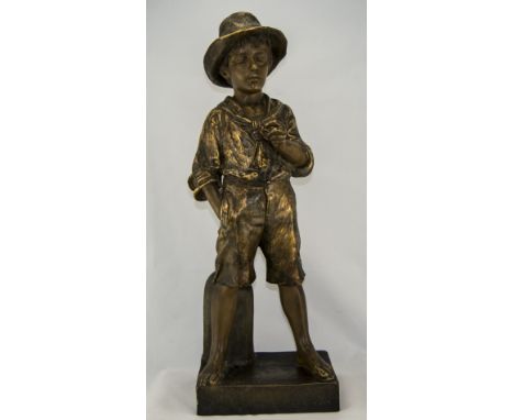 A Goldscheider Figure of a Boy Standing by a Mile Post with one hand in pocket. 23.5 inches tall. c 1920. Stamped and signed.