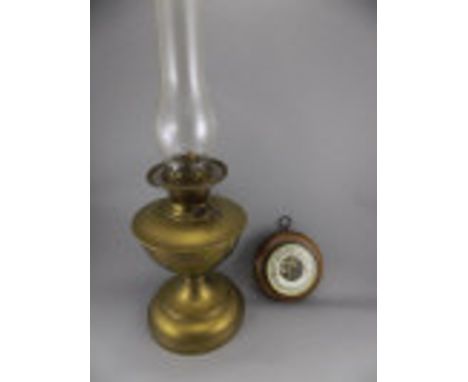 Early 20thC Brass Oil Lamp, glass funnel and double wick. 24 inches high. Together with a small round walnut barometer