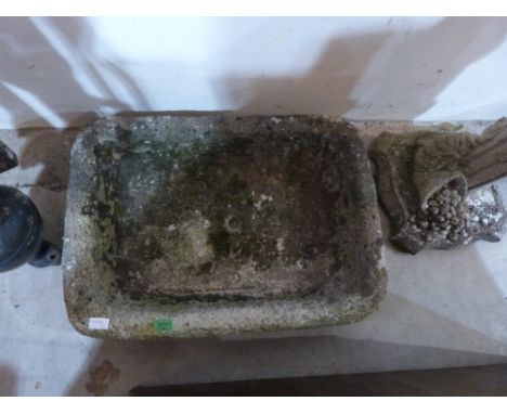 A stone garden basin planter
