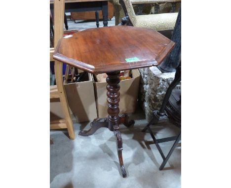 A Victorian walnut octagonal lamp table on bobbin turned column