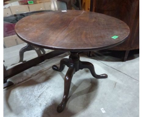 A George III mahogany tripod low table