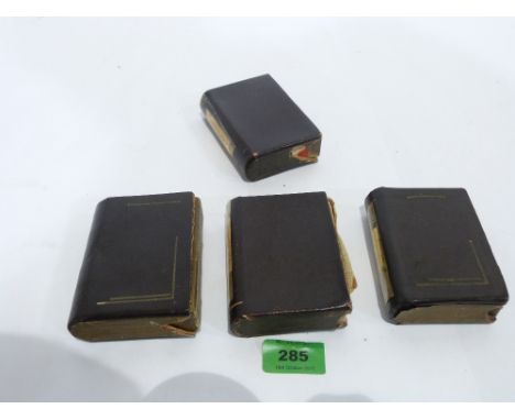 Four leather sleeved packs of children's playing cards, Quit; Happy Families; Animal Grab and Lexicon
