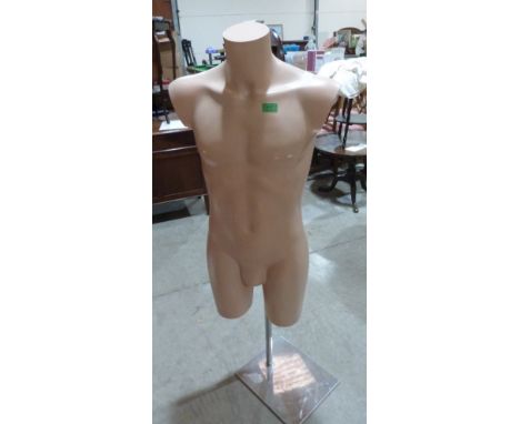 A mannequin on metal stand