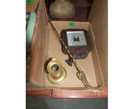 A small Black Forest style, a brass chamberstick and a toasting fork