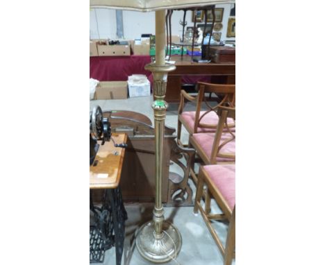 A silvered wood lamp standard