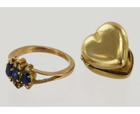 Yellow gold (tests 15ct) locket and ring, heart shaped locket, length 25mm, diamond and sapphire dress ring, three sapphires 