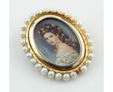 Yellow gold (tests 14ct) mounted minature portrait brooch/pendant, hand painted details and set with three diamonds, surround