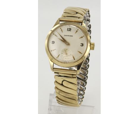 Gents 9ct cased Garrard manual wind wristwatch, hallmarked 1965. The cream dial with Arabic numerals at quarters, the rest ar