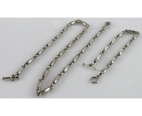 Georg Jensen modernist silver necklace and bracelet set, designed by Henry Pilstrup,  a series of articulated barrel-shaped l