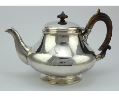 George IV silver teapot with worn wooden handle and wooden finial, bears worn hallmarks for Robert Hennell II London 1829 (in