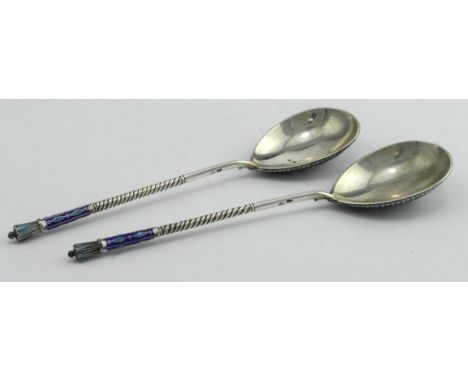 Two Russian silver and enamel spoons, one has some slight enamel damage to the top of its stem, both are marked with the Make