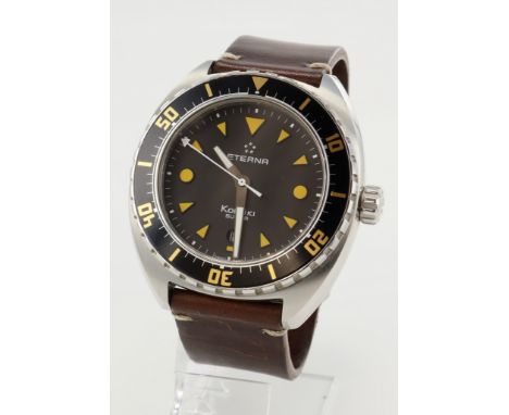 Eterna Super KonTiki gents automatic wristwatch, ref. 1273. The black dial with yellow dot markers at 3 and 9, the rest arrow