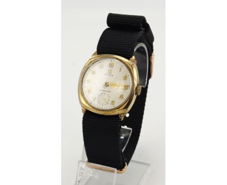 Gents 9ct cased Cyma Cymaflex manual wind wristwatch, hallmarked 1956. The cream dial with gilt Arabic numerals, black outer 