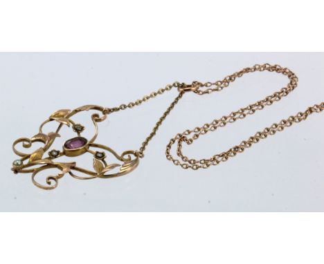 Yellow gold (tests 9ct) Edwardian lavalier necklace, set with seed pearls and one oval garnet measuring 6mm x 4mm, pendant su