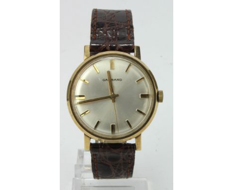 Gents 9ct cased Garrard manual wind wristwatch, hallmarked London 1971. The silvered dial with gilt baton markers. Case diame