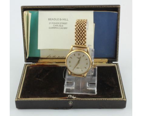 Gents 9ct gold cased Longines manual wind wristwatch, circa 1959. The champagne dial with Arabic numerals at quarters the rem