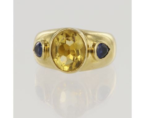 18ct yellow gold sapphire and citrine trilogy ring, one oval citrine measuring 10mm x 8mm, flanked with one pear cut sapphire