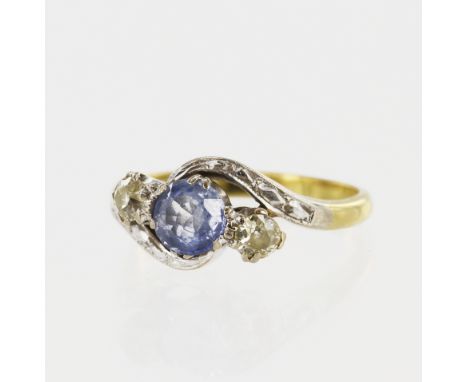 Yellow gold (tests 18ct) diamond and sapphire trilogy ring, one round cornflower blue sapphire measuring 5mm, flanked by one 