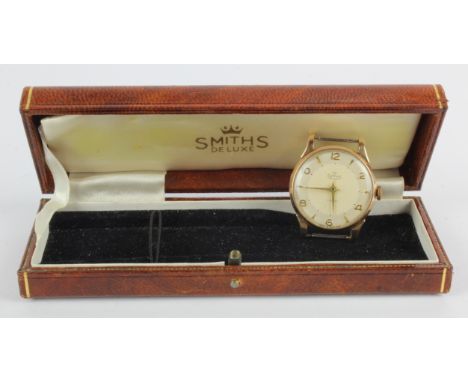 Gents 9ct gold cased Smiths De Luxe manual wind wristwatch, hallmarked Edinburgh 1954. The two-tone cream dial with Arabic nu