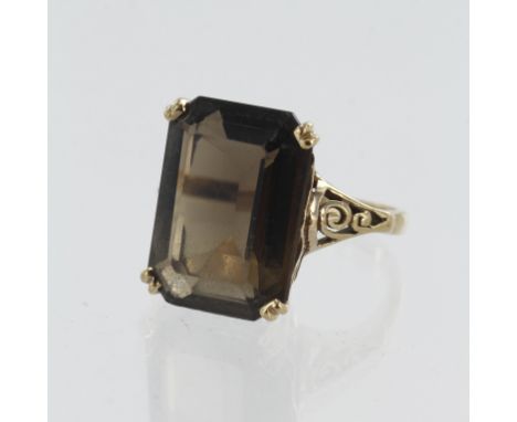 Yellow gold (tests 9ct) smoky quartz cocktail ring, quartz measures 18mm x 13mm, finger size R, weight 6.6g.