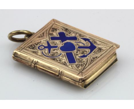 Yellow gold (tests 8ct) antique faith, hope &amp; charity book locket, profusely engraved with blue enamel details, inside ha