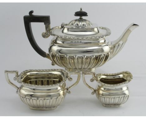 Queen Anne style three piece silver tea set comprising teapot, sugar bowl and cream jug. All hallmarked WA Birm. 1911. Gross 