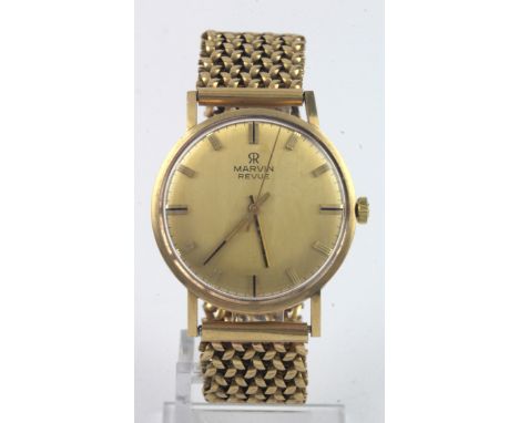 Gents 9ct cased Marvin Revue manual wind wristwatch. Case diameter approx 34mm on a 9ct bracelet hallmarked London 1970. Tota