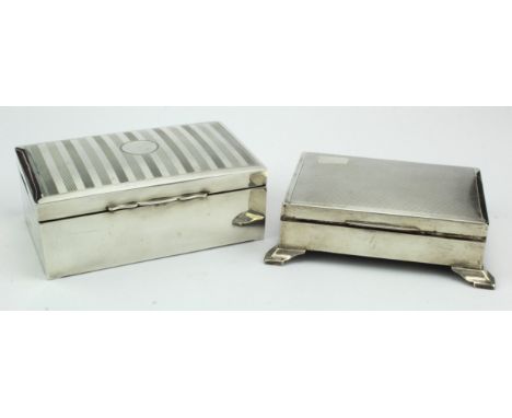 Two silver engine-turned cigarette boxes with wooden interiors, hallmarked for Chester 1931 &amp; Birmingham 1925.   