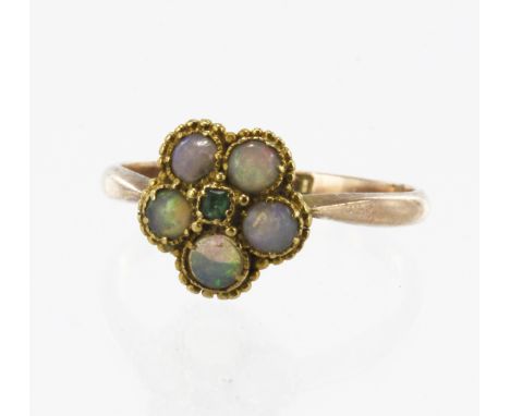 Rose gold (tests 15ct) vintage emerald and opal daisy cluster ring, one step cut emerald approx. 1.8mm x 1.8mm, five round ca