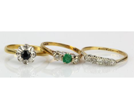 Three 18ct gold/tests 18ct rings, stones include diamond, sapphire and emerald, finger sizes K/L, N,O, total weight 7.3g.