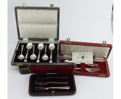 Mixed lot of silver flatware in four boxes comprising six silver pastry forks, three silver pickle forks, six silver teaspoon