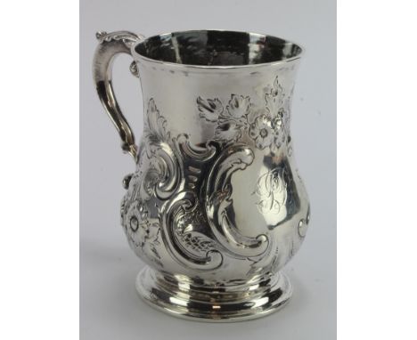 Early 18th c. silver tankard with later embossing, the hallmarks are very worn but they stand for the Britannia Standard, the